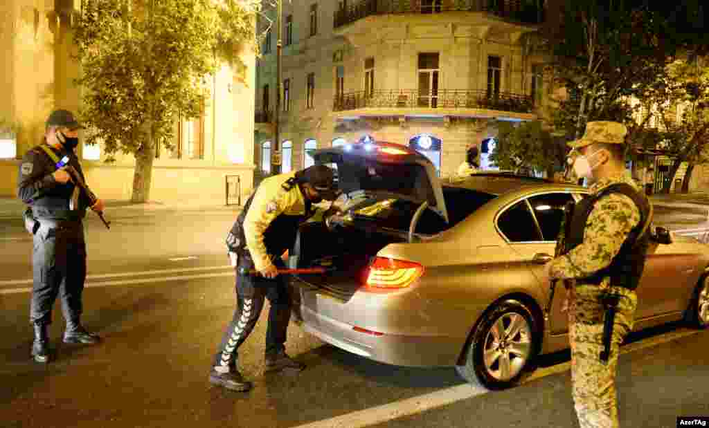 Police check a car in Baku shortly after the conflict broke out. Both Armenia and Azerbaijan announced martial law when the war in Nagorno-Karabakh began. 