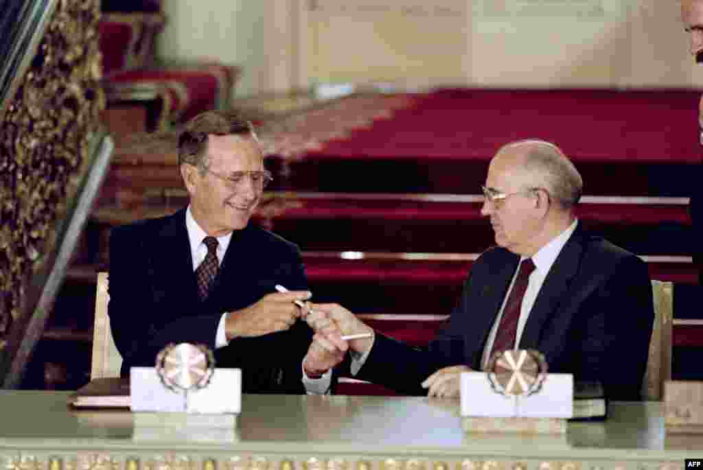 U.S. President George H.W. Bush and Gorbachev exchange pens after signing the historic Strategic Arms Reduction Treaty (START), which cut the superpowers' nuclear arsenals by up to one-third, in Moscow on July 31, 1991.