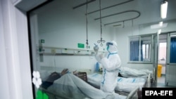 Medical staff in Wuhan, China, where the city is under lockdown. 