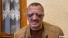Tofiq Yaqublu, 60, said police beat him while demanding that he say on camera that he would stop criticizing Azerbaijan's leadership.