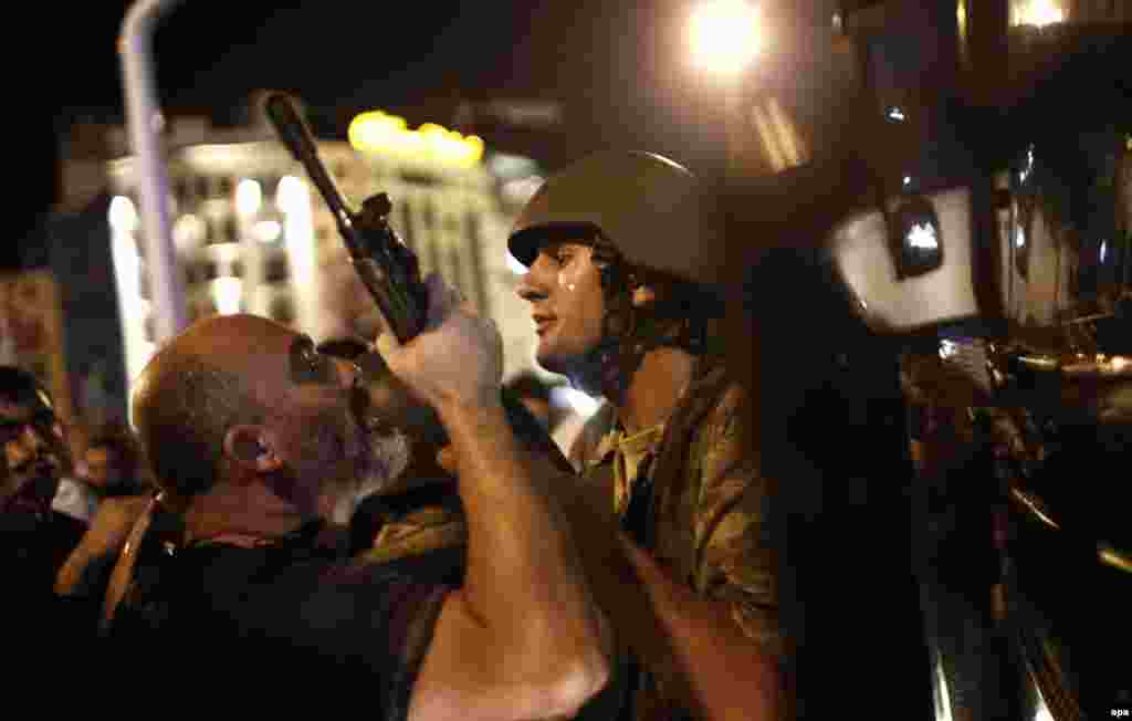 Turkish police arrested Turkish soldiers at Taksim Square in Istanbul. The police force is seen as more closely aligned to the Turkish government than its military, which has traditionally been seen as a protector of Turkey's secular, democratic constitution.