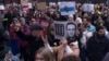 People attend a protest march to comemorate Russian opposition leader Aleksei Navalny near the Russian Embassy in Berlin on February 18.