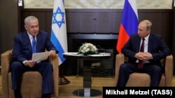 Израилдин премьер-министри Биньямин Нетаньяху жана Орусиянын президенти Владимир Путин.