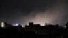 Dust rises from the site of US strikes in Sanaa, the Yemeni capital, on March 15.