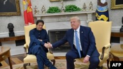 U.S. President Donald Trump (right) shakes hands with Pakistani Prime Minister Imran Khan at the White House on July 22. 