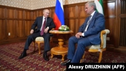 Russian President Vladimir Putin (left) meets with Raul Khadzhimba, the leader of Georgia's breakaway region of Abkhazia, on August 8.